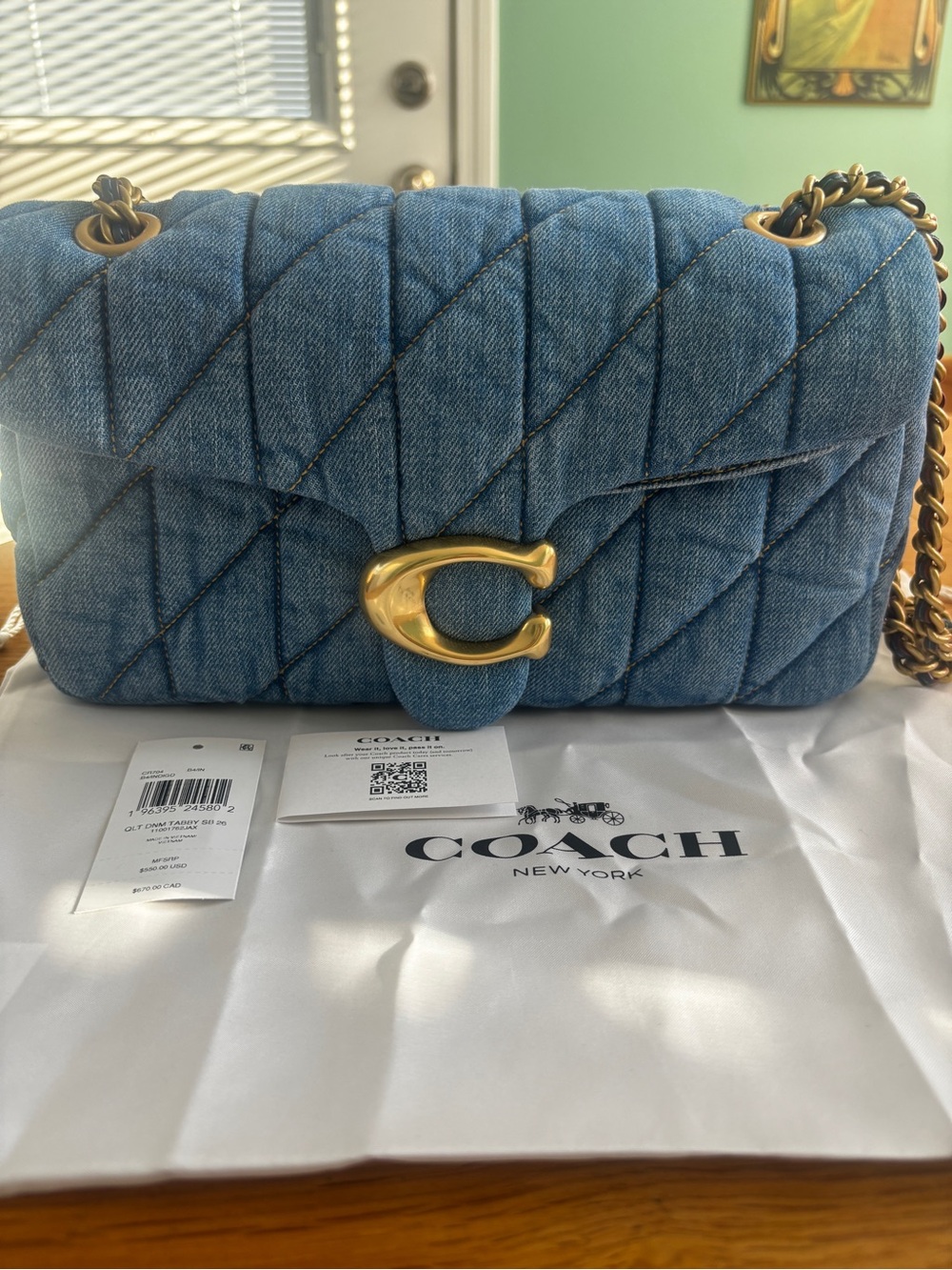 Like new, Coach Quilted Tabby 26 in denim CR704